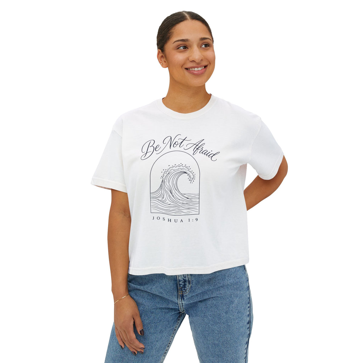 Be Not Afraid Wave Crop Tee, crop tee, White, front view, worn by a woman, Be Not Afraid wave in an arch, Joshua 1:9 (KJV)