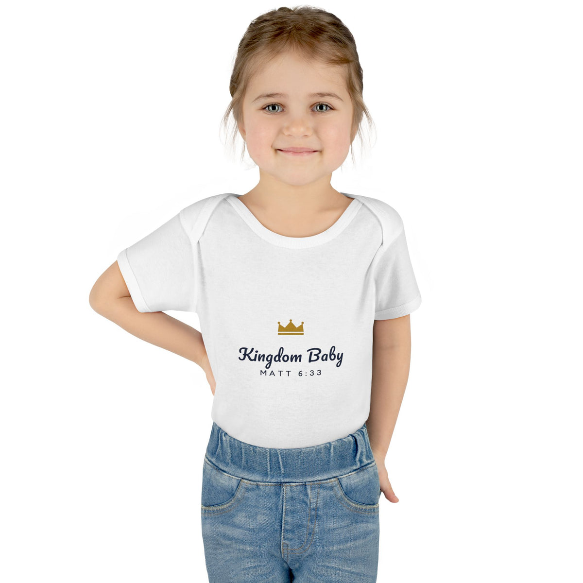 Kingdom Baby Bodysuit, baby bodysuit, White, front view, worn by a toddler with jeans, KINGDOM BABY with gold crown, Matthew 6:33 (KJV)