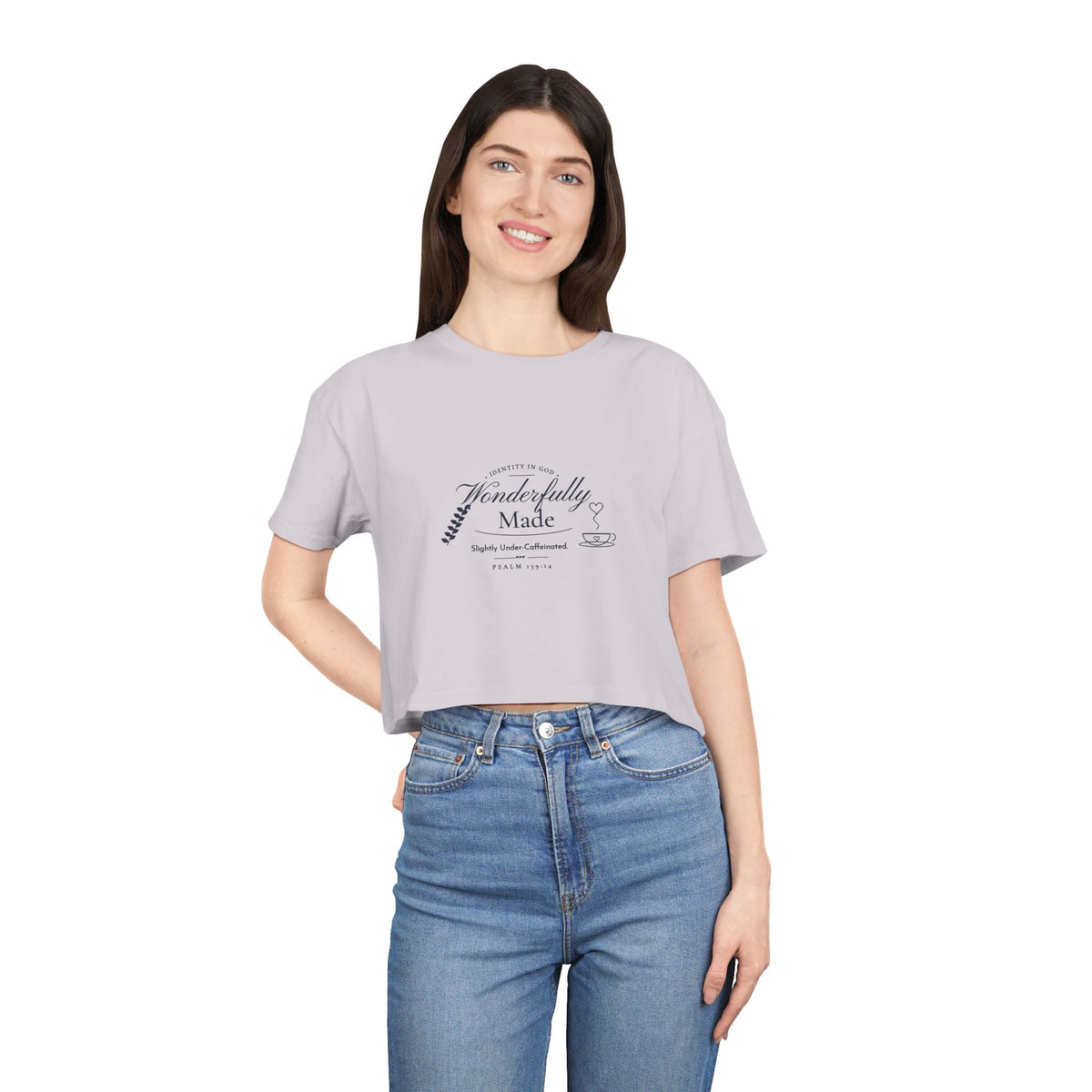Wonderfully Made Crop Tee in Orchid, worn by a woman, front view: IDENTITY IN GOD, Wonderfully Made script with a leaf and coffee cup, Slightly Under-Caffeinated. and PSALM 139:14, Psalm 139:14 (KJV)