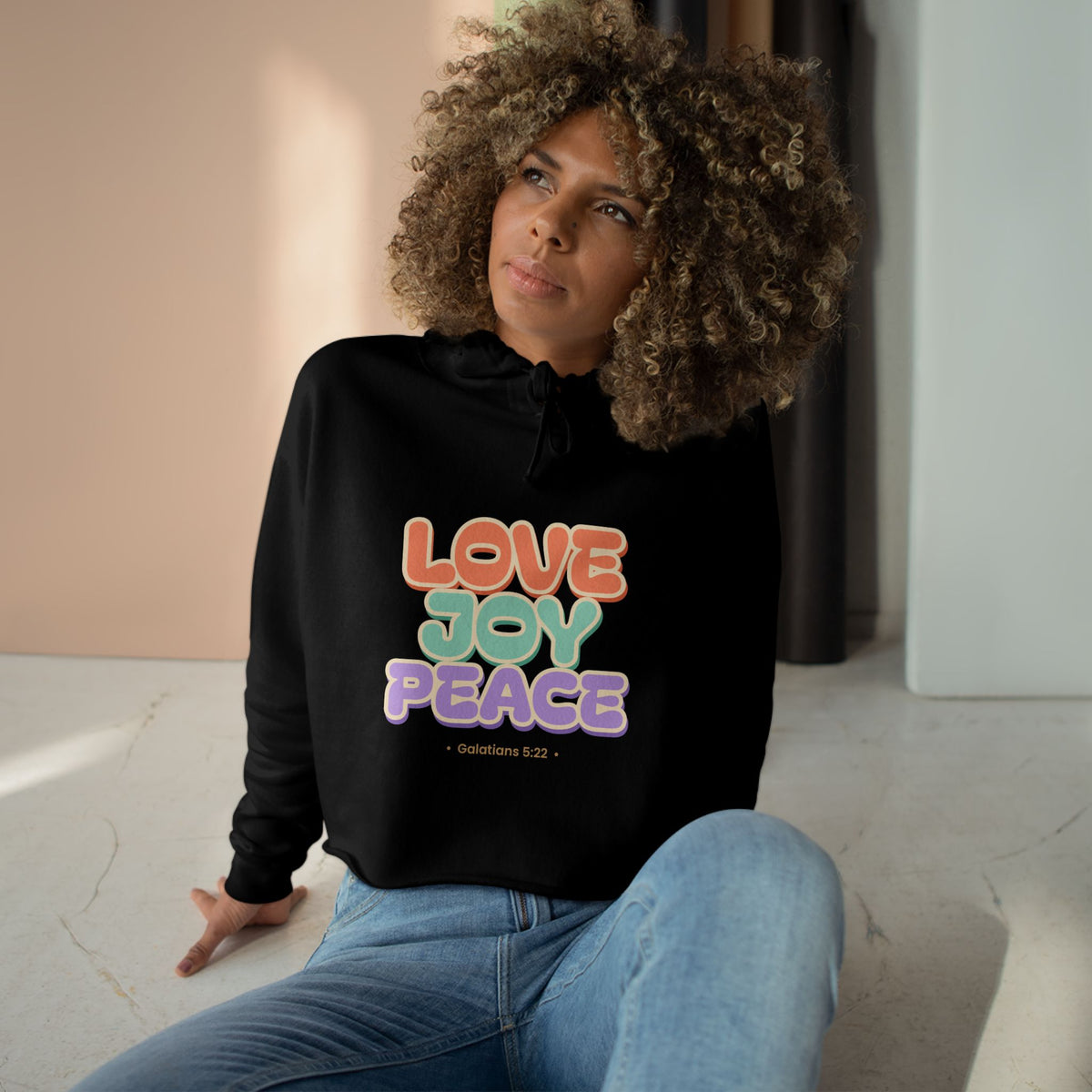 Love Joy Peace Crop Hoodie, crop hoodie, Black, front view, worn by a woman, LOVE. JOY. PEACE., Galatians 5:22 (KJV)