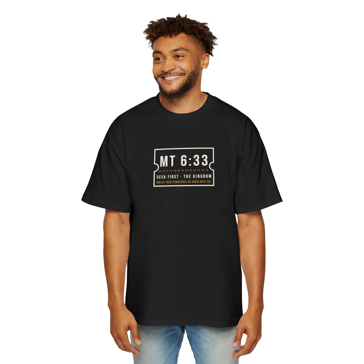 MT 6:33 Oversized Tee in Black, worn by a man, front view: MT 6:33 · SEEK FIRST · THE KINGDOM chest print, Matthew 6:33 (KJV)